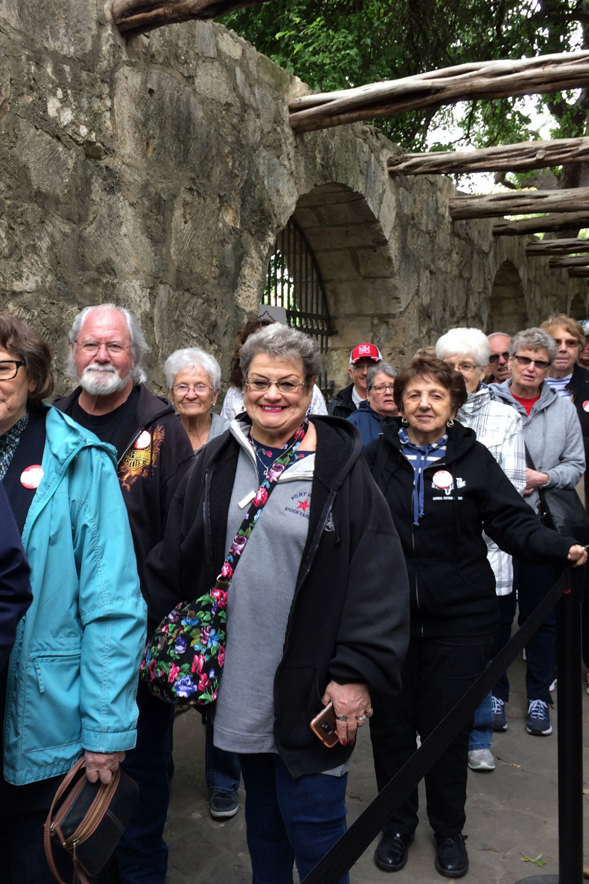 122 Fun Club travelers in line to enter the Alamo.JPG